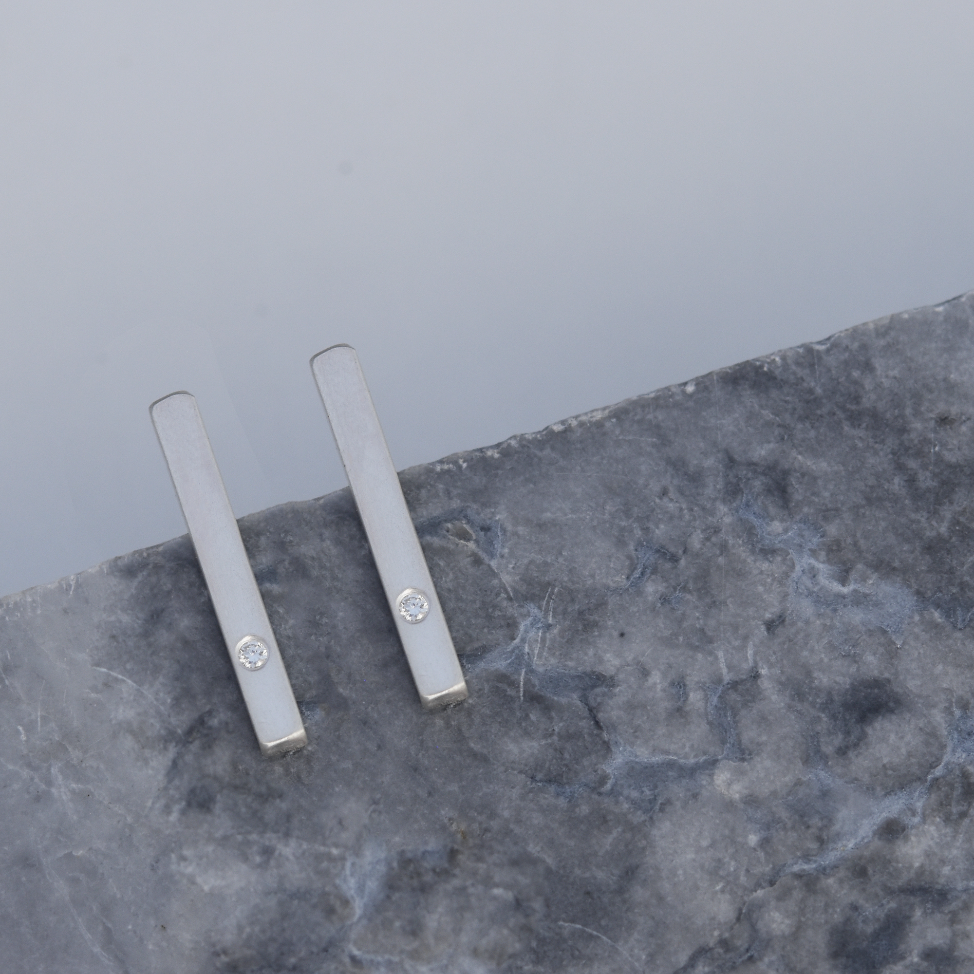 Inch long square wire sterling silver bar stud earrings with a 2mm diamond set toward the bottom of the bar for a little bit of sparkle!