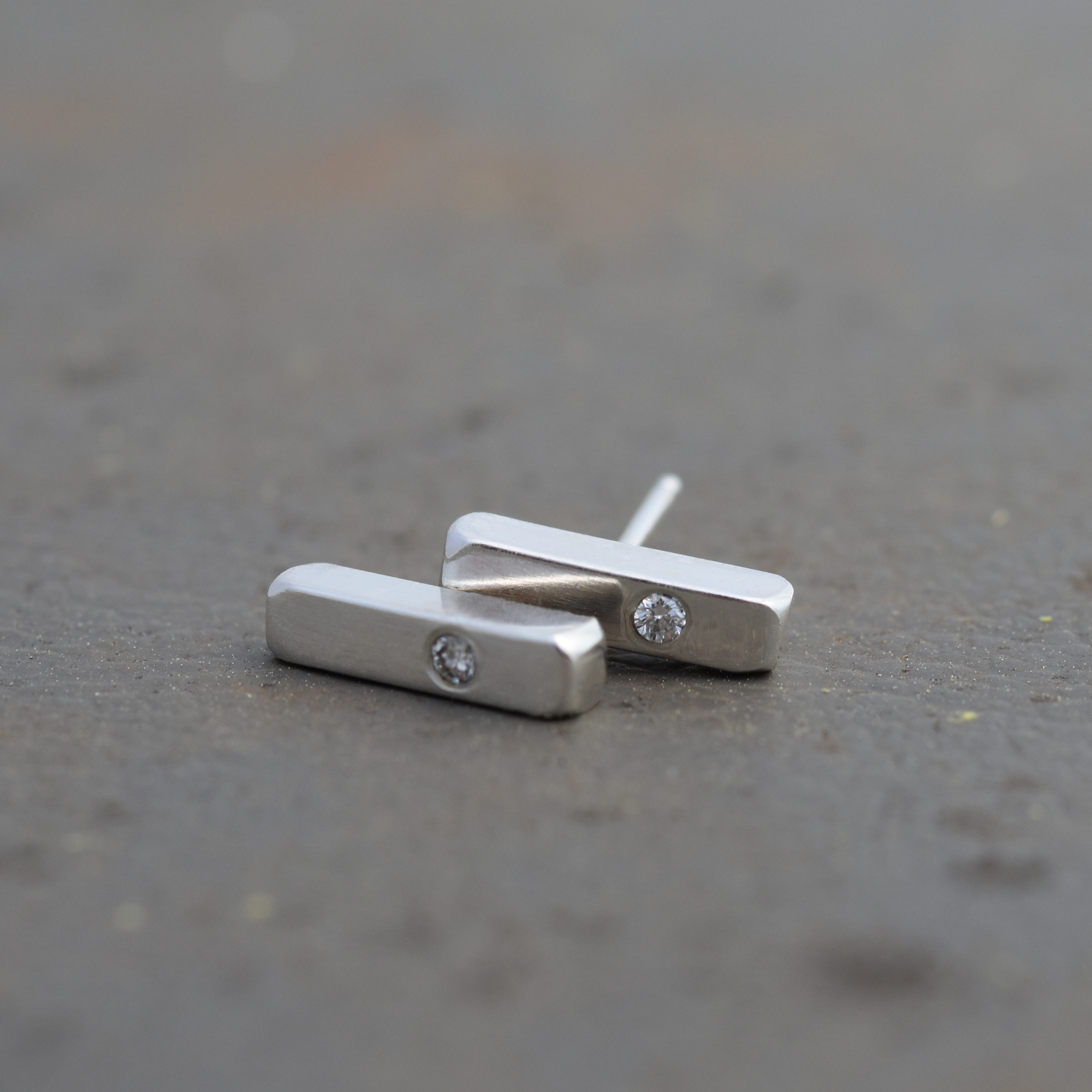 Half inch sterling silver bar studs with a 2 mm diamond to add a little bit of bling.
