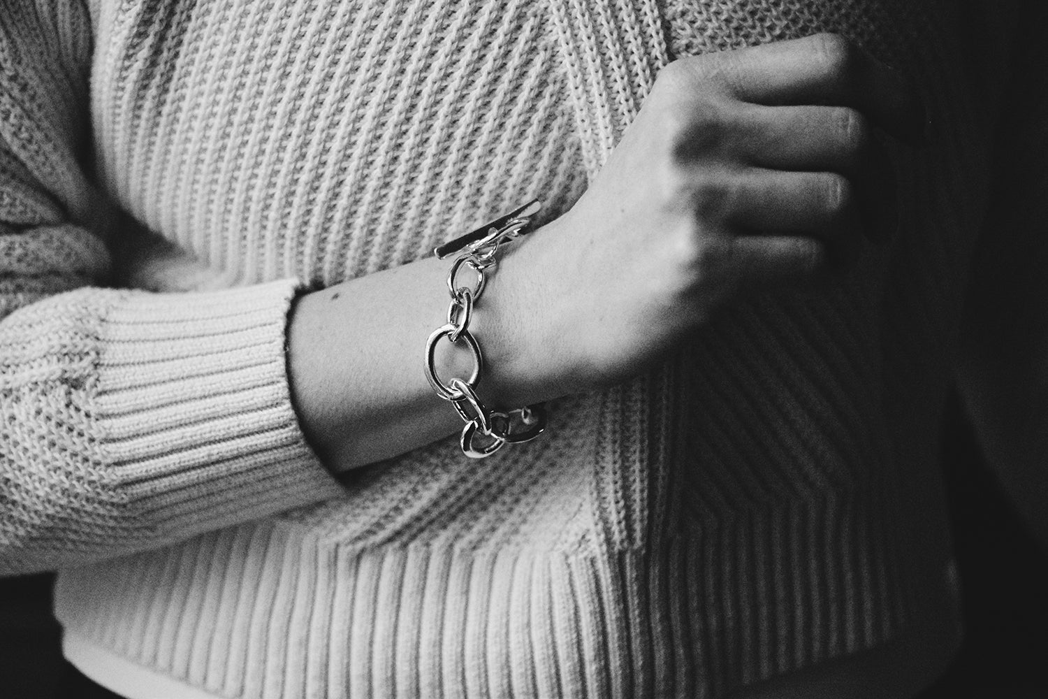 The Alana Bracelet on a model for scale. Image shows the organic, variable sterling silver links, as well as the statement toggle.