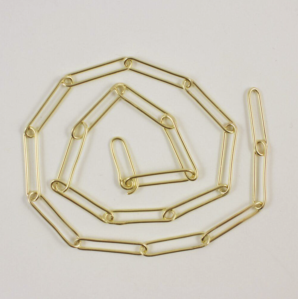 Flat lain spiral photo of the 18 karat gold paperclip chain necklace.