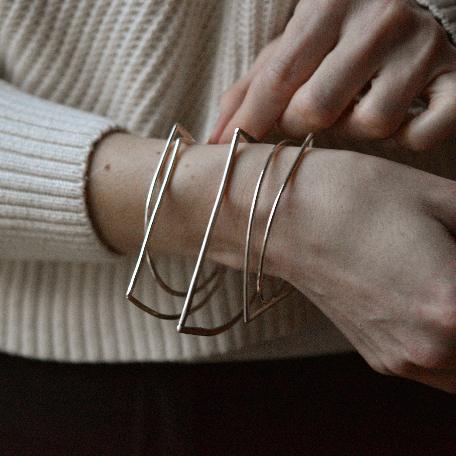 an image of five sterling silver c bar bangles with a flat edge, perfect for people who spend lots of time on their computer