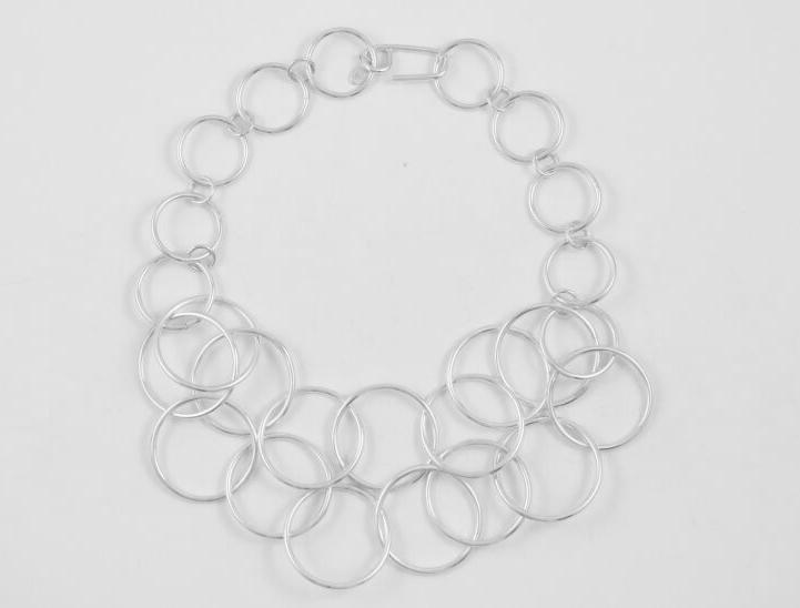 Flat lain photo of the Double Circle Choker that shows how the two layers of circle links drape over one another.