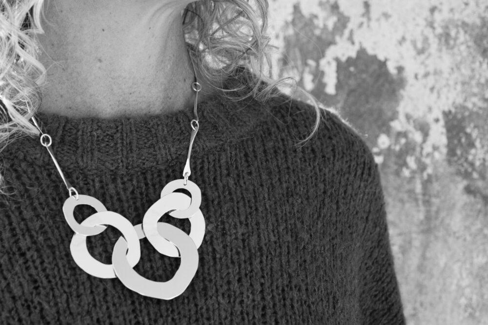 Five Ring Cut Out Necklace on a model for scale.